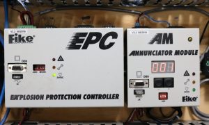 Photo of the Fike Explosion Protection Controller and module hooked up to a machine